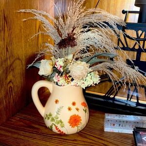 Water basin dried floral arrangement